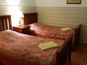 Ліжко або ліжка в номері About Town Cottages