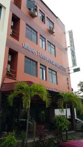 a building with a sign on the front of it at Lotus Hotel Johor Bahru in Johor Bahru +5 photos