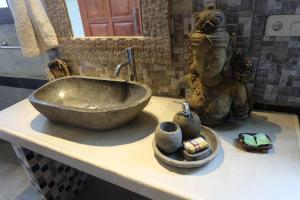 Kylpyhuone majoituspaikassa Tirta Asri Ubud Villa