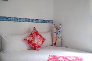 Postel nebo postele na pokoji v ubytování Hsin Hsin Hotel