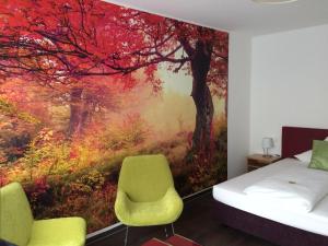 Postel nebo postele na pokoji v ubytování Hotel Schober