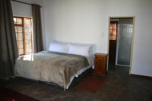 Säng eller sängar i ett rum på Matjiesvlei Retreat Swartskaap/Blacksheep