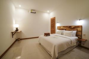 Giường trong phòng chung tại Ibludan Hotel