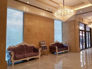 Predel za sedenje v nastanitvi Ramada Hong Kong Grand View