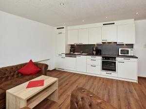 A kitchen or kitchenette at A CASA Opal Appartements
