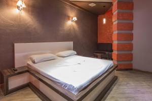 Letto o letti in una camera di Green Palace Hotel