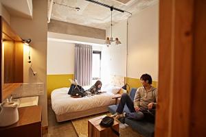 Postel nebo postele na pokoji v ubytování Wise Owl Hostels Shibuya + 37 fotografií