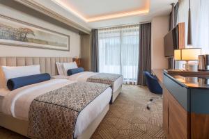 Postel nebo postele na pokoji v ubytování Golden Tulip Istanbul Bayrampasa