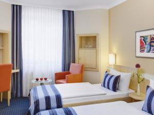 Voodi või voodid majutusasutuse IntercityHotel Nürnberg toas