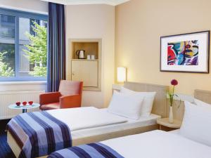Voodi või voodid majutusasutuse IntercityHotel Nürnberg toas