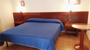 Postel nebo postele na pokoji v ubytování Residence Arenella