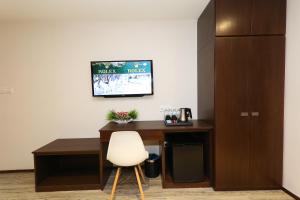 TV a/nebo společenská místnost v ubytování M&M Hotel