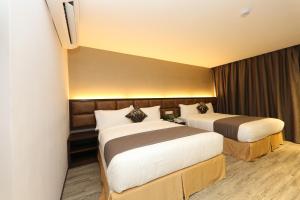 Postel nebo postele na pokoji v ubytování M&M Hotel + 19 fotografií