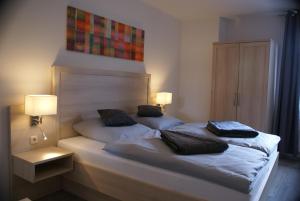 Postel nebo postele na pokoji v ubytování Hotel Garni Alte Post