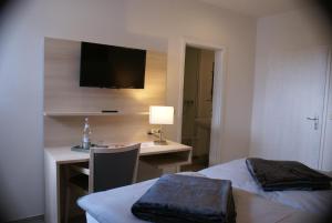 Postel nebo postele na pokoji v ubytování Hotel Garni Alte Post