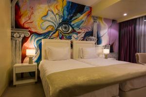 Cama ou camas em um quarto em Ganzo Boutique Hotel