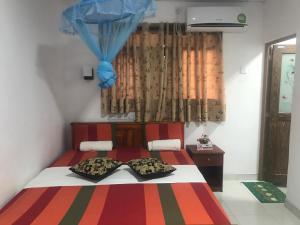 Giường trong phòng chung tại Hotel Camorich