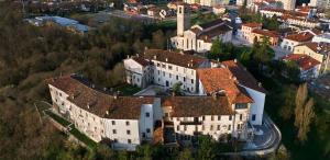 an aerial view of a large building with red roofs at Hotel STELLA D'ORO in Spilimbergo