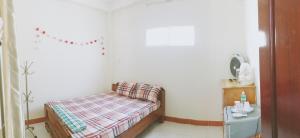 Postel nebo postele na pokoji v ubytování Chang Homestay + 1 fotografie