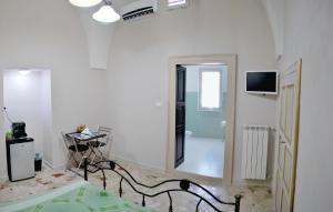 a large white room with a television on the wall at b&b porta nuova mesagne in Mesagne