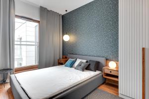 Posteľ alebo postele v izbe v ubytovaní Nowa Motława SPA Apartments Old Town