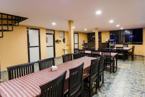 a dining room with tables and chairs and tablesktop at Kathmandu City Hotel in Kathmandu