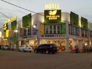 a large building with cars parked in front of it at Golden Leaves Hotel in Malacca