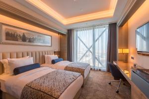 Postel nebo postele na pokoji v ubytování Golden Tulip Istanbul Bayrampasa
