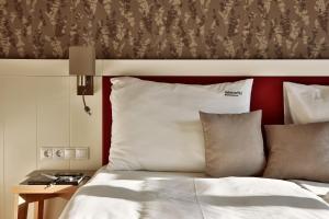Postel nebo postele na pokoji v ubytování Hubertus Hof Landhotel