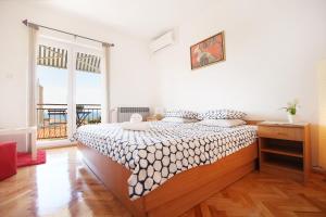Rúm í herbergi á Guesthouse Marta