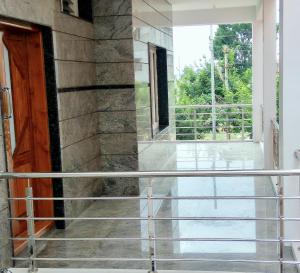 a view from the front door of a house at Aashraya Homestay in Mysore