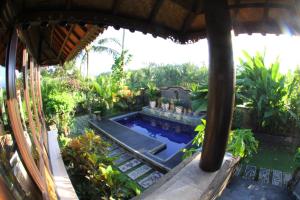 an image of a backyard with a swimming pool at Villa Gede Private Guest House in Selemadeg