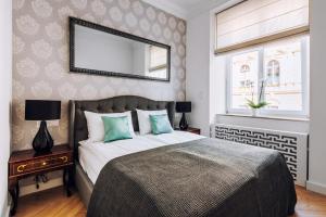 Posteľ alebo postele v izbe v ubytovaní Szpitalna 20 Apartment 3