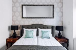 Posteľ alebo postele v izbe v ubytovaní Szpitalna 20 Apartment 3