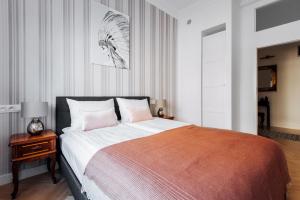 Posteľ alebo postele v izbe v ubytovaní Szpitalna 20 Apartment 3