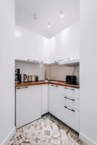 Kuchyňa alebo kuchynka v ubytovaní Szpitalna 20 Apartment 3