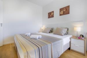 Postel nebo postele na pokoji v ubytování Royal Apartments