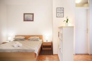 Postel nebo postele na pokoji v ubytování Guesthouse Marta