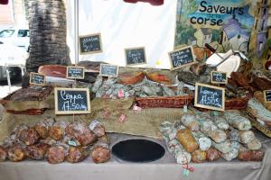a display of different types of food on a table at Residence ACQUA LINDA Porticcio in Porticcio