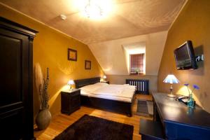 Postel nebo postele na pokoji v ubytování Hotel Horní Dvůr