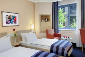Voodi või voodid majutusasutuse IntercityHotel Nürnberg toas