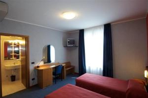 Postel nebo postele na pokoji v ubytování Hotel Residence Ducale