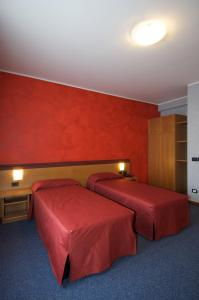 Postel nebo postele na pokoji v ubytování Hotel Residence Ducale