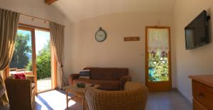 a living room with a couch and a table at Le chalet d'Heidi in Bourg-Saint-Maurice