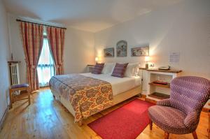 Ein Bett oder Betten in einem Zimmer der Unterkunft Hotel La Grange - Animal Chic Hotel