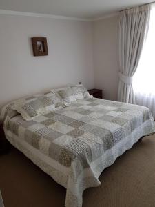 Giường trong phòng chung tại Mar Egeo