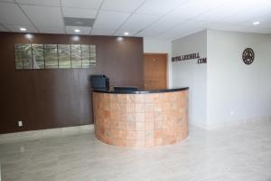 a lobby with a brick counter in a room at Hotel Lexihill in Lexington