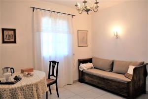 a living room with a couch and a table at Lousoan in Aix-en-Provence