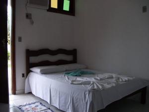 Postel nebo postele na pokoji v ubytování Pousada Hawai