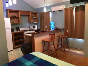 A kitchen or kitchenette at Tilt-Ta-Dock Resort Belize